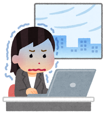 寒い部屋で働く女性